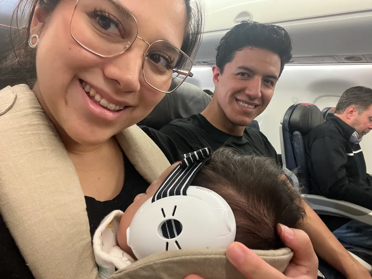 Mom holding baby at the airport